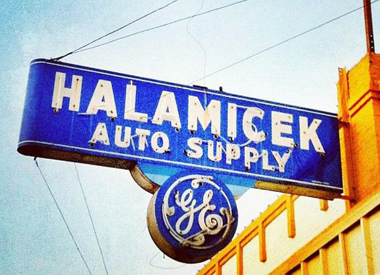 Showing an antique sign for Halamicek Auto Supply.