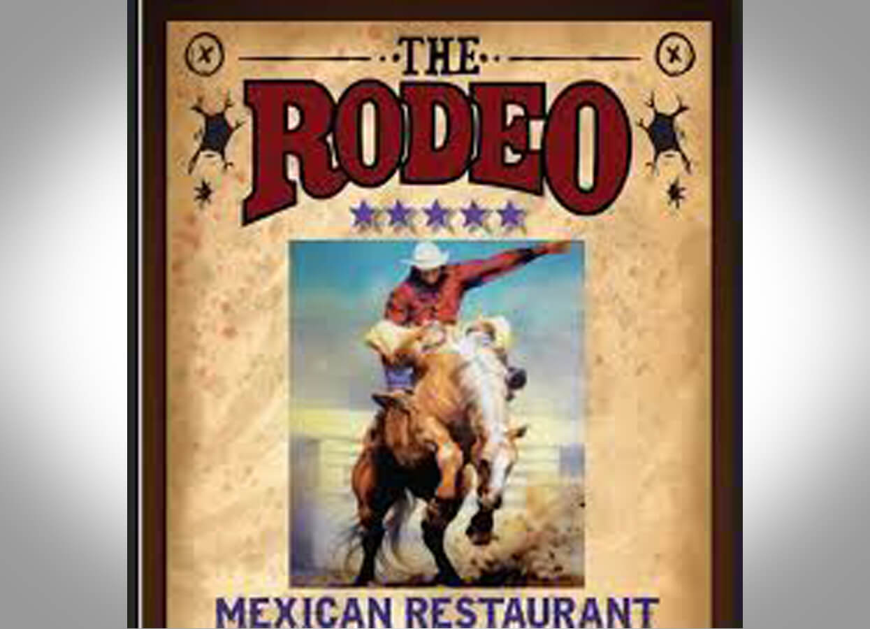 Showing a photo of a gaucho hanging on the wall of Rodeo Mexican Restaurant.